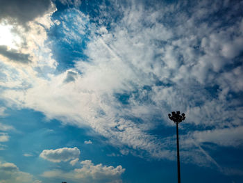 Low angle view of silhouette street against sky