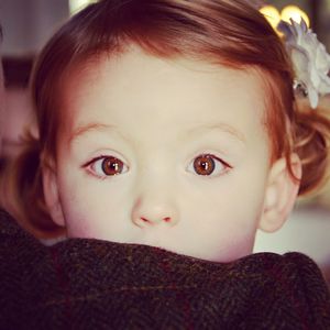 Close-up portrait of cute girl with brown eyes