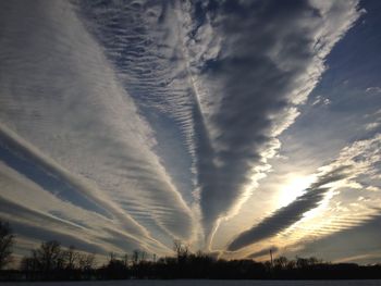 Scenic view of landscape against sky at sunset