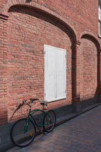 Bicycle against brick wall