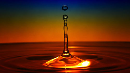 Close-up of drop falling in water