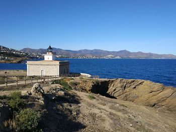 Scenic view of sea against clear blue sky