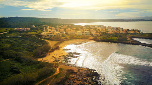 High angle view of castle by sea against sky
