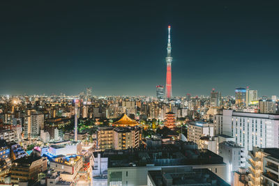 Illuminated buildings in city at night