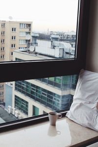 View of buildings through balcony