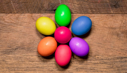 High angle view of multi colored eggs on table