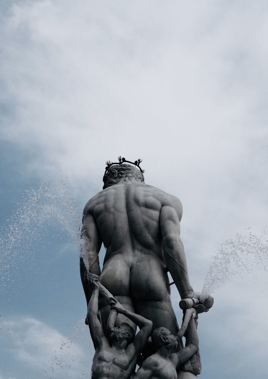 LOW ANGLE VIEW OF STATUE AGAINST SKY AND CLOUDS