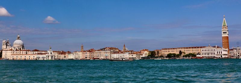 View of buildings by canal against sky in venice 