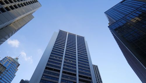 Low angle view of modern buildings against sky in city
