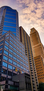 Low angle view of modern buildings against sky