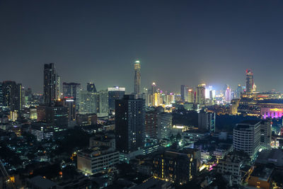 Illuminated buildings in city at night