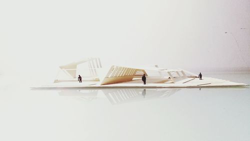 High angle view of book on table against white background