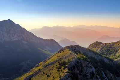 Scenic view of mountains against sky during sunset