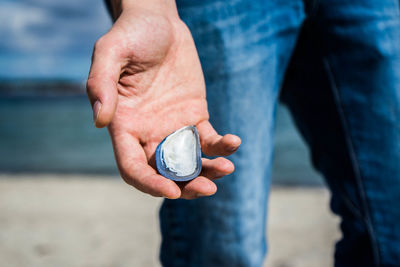 Close-up of man holding hands