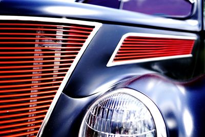 Close-up of car on road