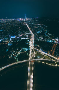 High angle view of illuminated city buildings at night