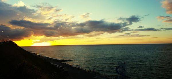 Scenic view of sea at sunset