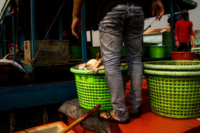 Rear view of man working at market