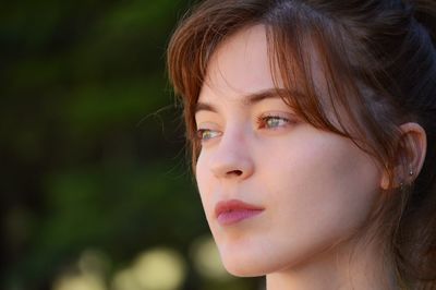 Close-up of thoughtful woman looking away