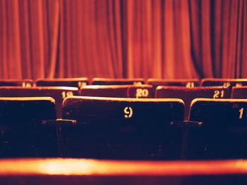 Close-up of chairs in row