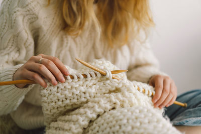 Teengirl knitting at home. handmade and hobby.