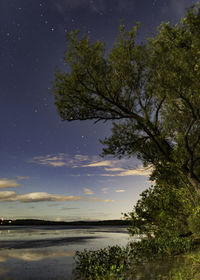 Scenic view of sea against sky at night