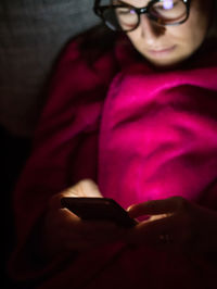Close-up of child using mobile phone