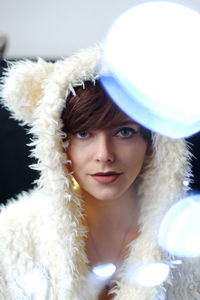 Portrait of young woman in hat