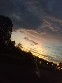 Silhouette trees against sky during sunset