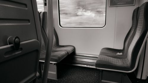 Empty seats by window in train