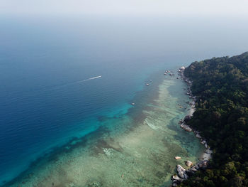 High angle view of bay on shore against sky