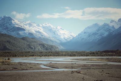 Scenic view of snowcapped mountains against sky