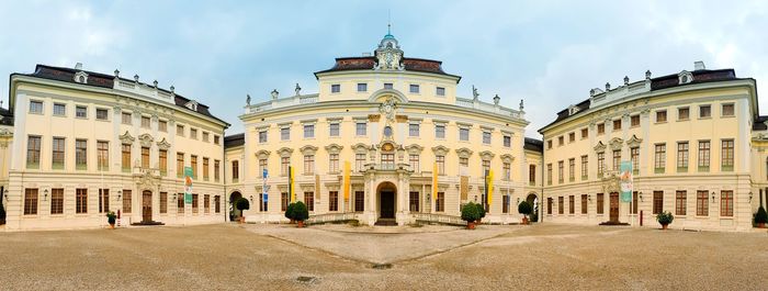 Facade of historic building in city against sky