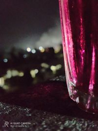 Close-up of illuminated glass on table