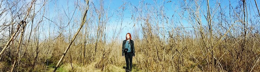 Silhouette of woman standing on field