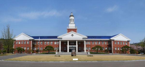 Facade of building against blue sky