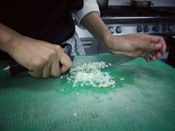 Midsection of man preparing food on table