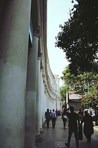 People walking on street in city