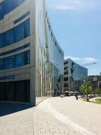 Exterior of modern buildings in city against sky