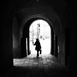 Full length of woman walking on railing