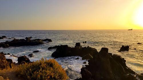 Scenic view of sea against sky during sunset