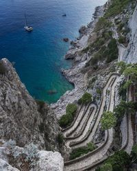 High angle view of sailboats on sea shore