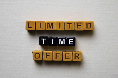 Close-up of information sign on table