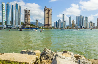 View of buildings in city at waterfront