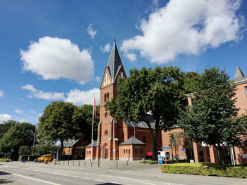 Street by church during sunny day