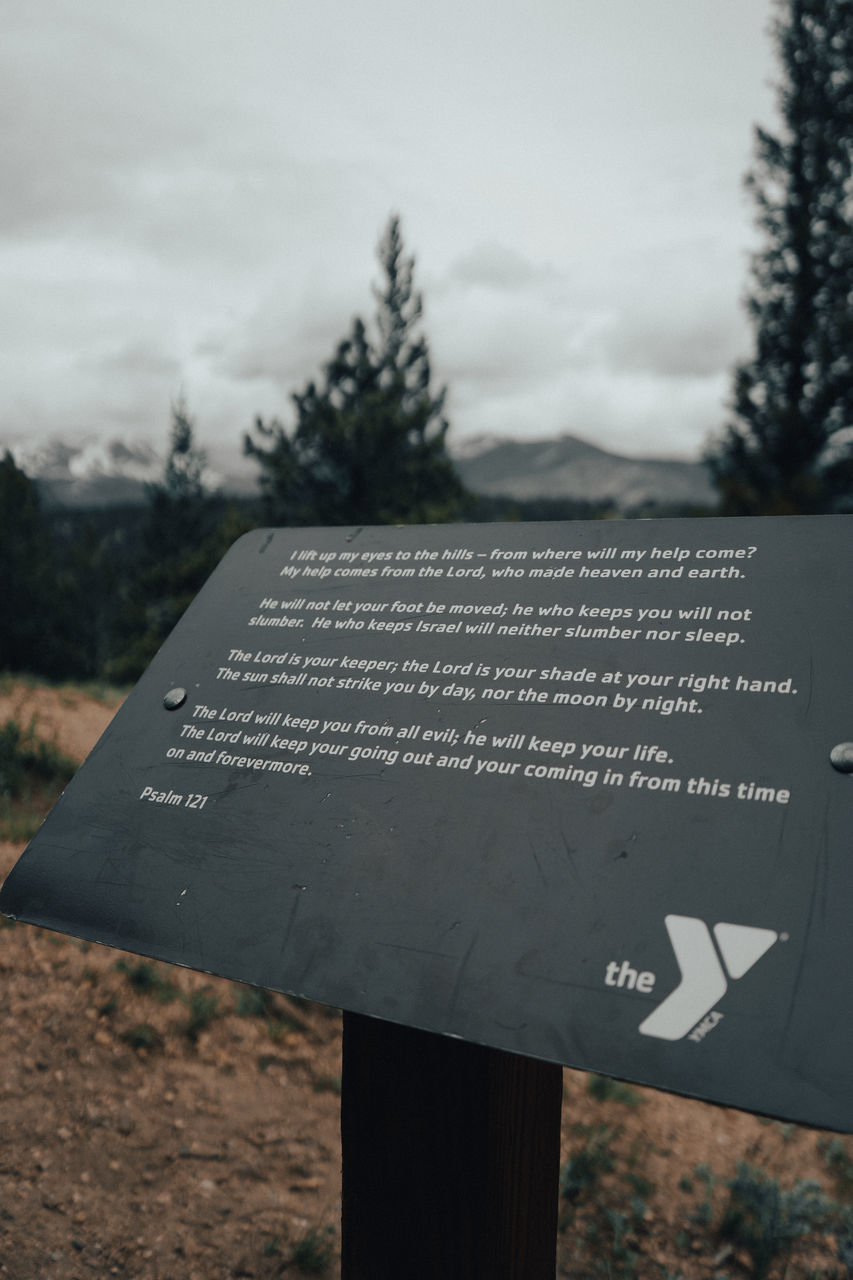 text, communication, western script, sign, tree, no people, nature, guidance, day, information sign, plant, sky, focus on foreground, outdoors, close-up, memorial