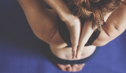 High angle view of woman practicing yoga