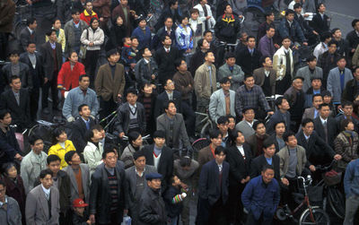 High angle view of people standing on street