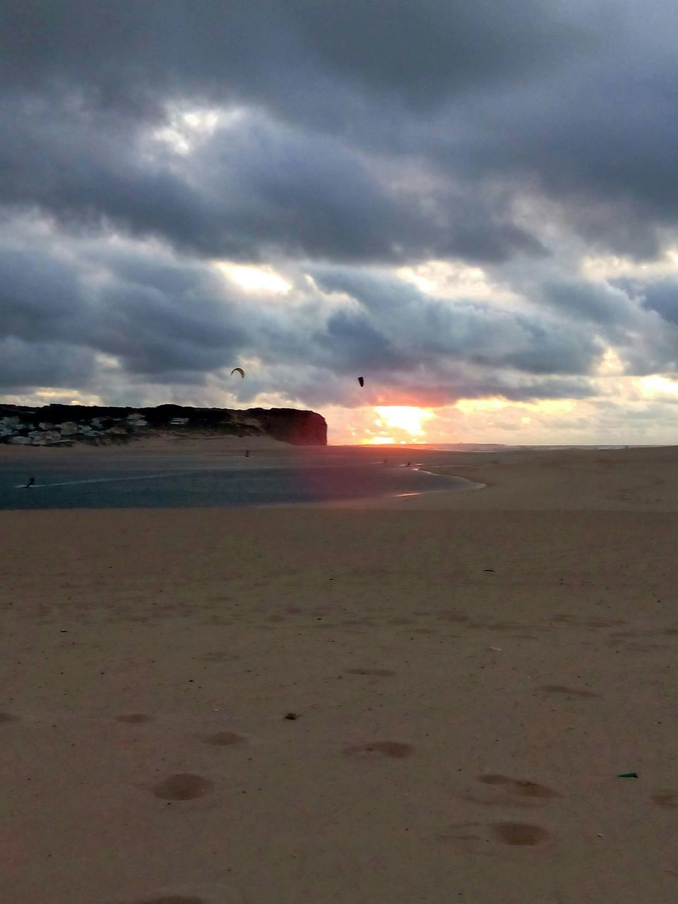 beach, sky, sea, sand, cloud - sky, shore, horizon over water, scenics, tranquil scene, cloudy, tranquility, beauty in nature, water, nature, sunset, cloud, idyllic, bird, weather, overcast