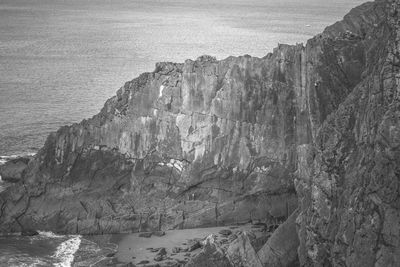 High angle view of rock formations by sea